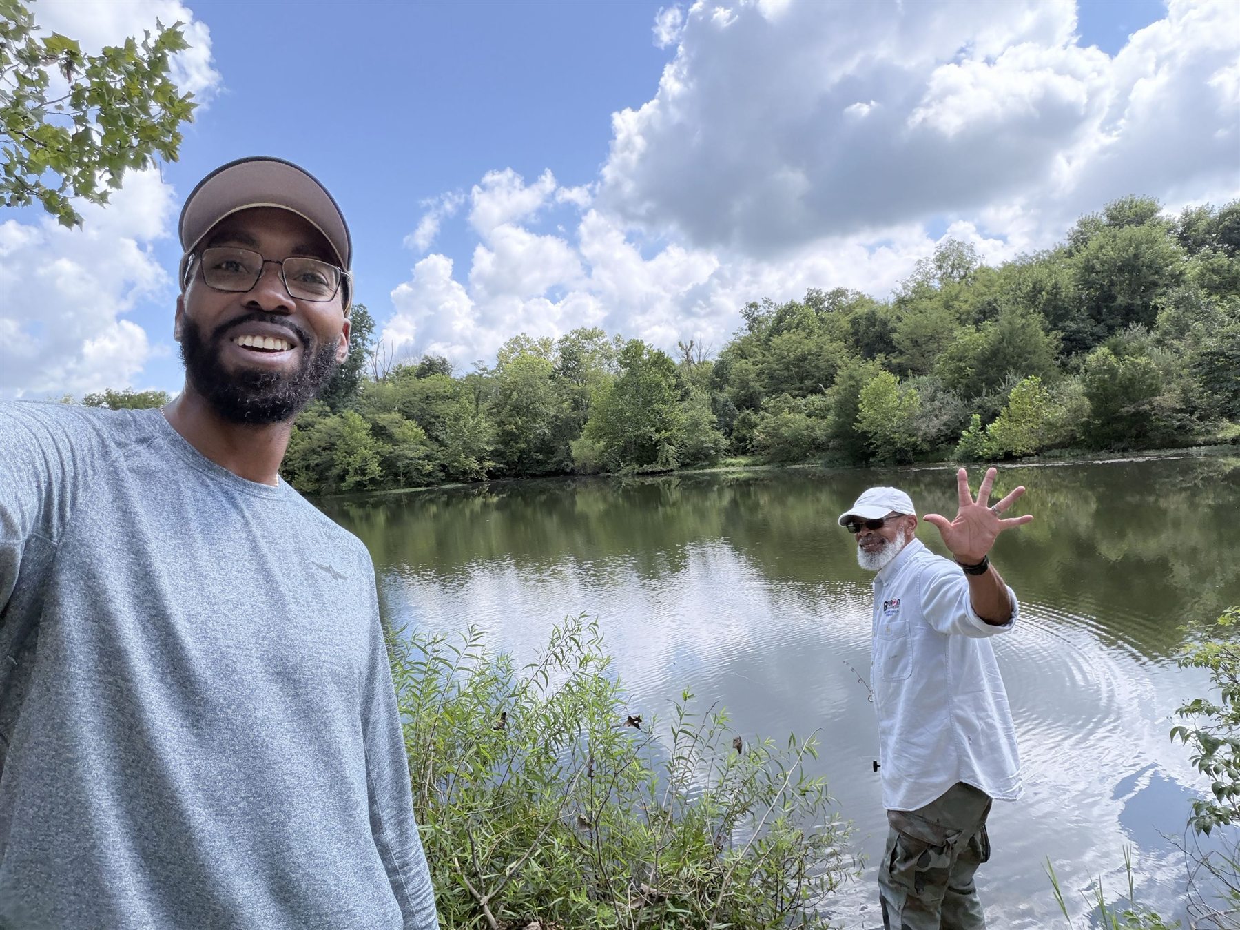 Nigel Benton with his father beside a lake